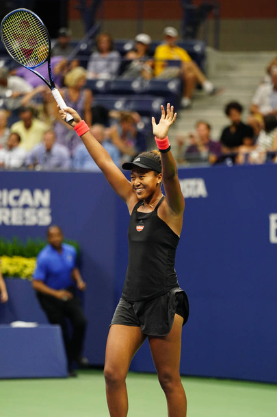 NEW YORK - SEPTEMBER 6, 2018: Professional tennis player Naomi Osaka celebrates victory after 2018 US Open semi-final match at Billie Jean King National Tennis Center       - Photo, Image
