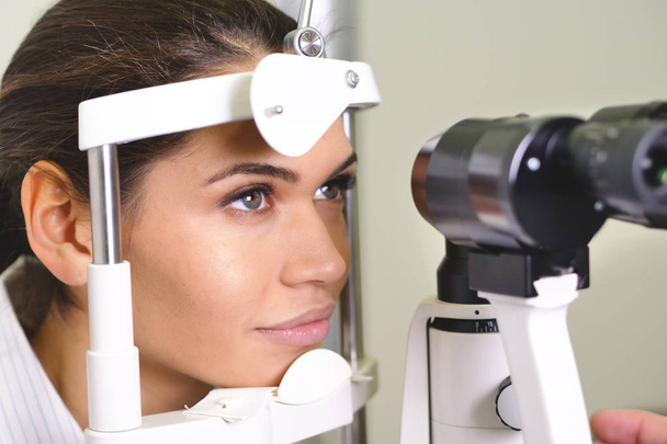 woman checking eyes, Slit lamp examination of eyes in ophthalmology clinic - Fotoğraf, Görsel