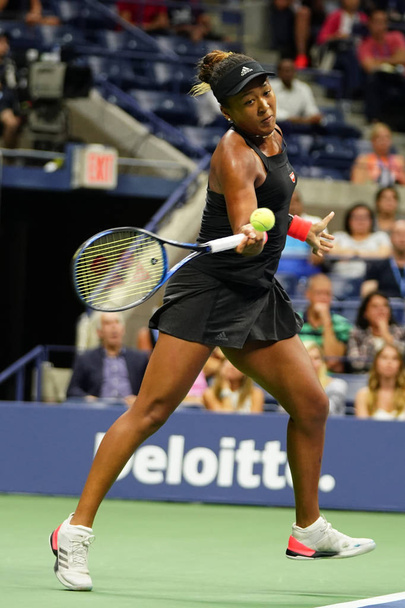 NEW YORK - SEPTEMBER 6, 2018: Professional tennis player Naomi Osaka in action during her 2018 US Open semi-final match at Billie Jean King National Tennis Center - 写真・画像