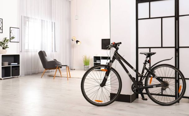 Light living room interior with modern bicycle - Zdjęcie, obraz