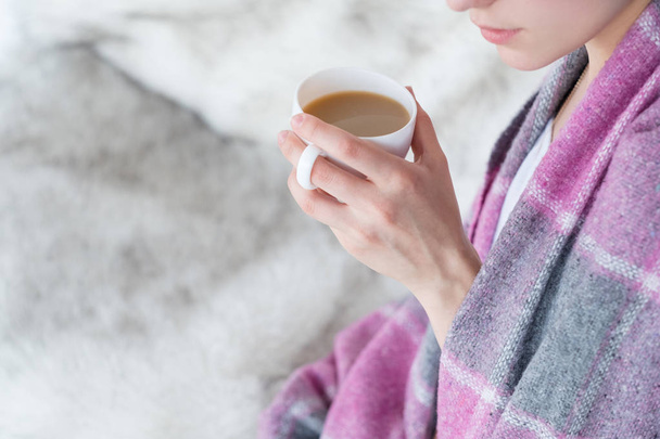 woman blanket hold coffee mug drink hot beverage - Foto, Imagem