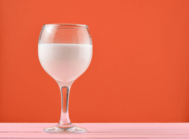 A glass of fresh natural milk on a yellow background. Copy space - Foto, afbeelding