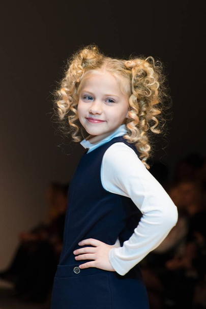 girl wears children dress collection at the international exhibition of the fashion, Kid's fashion day during Belarus Fashion Week - Foto, immagini