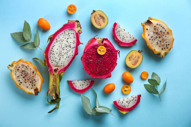 Tasty pitahaya and other fruits on color background - Photo, Image