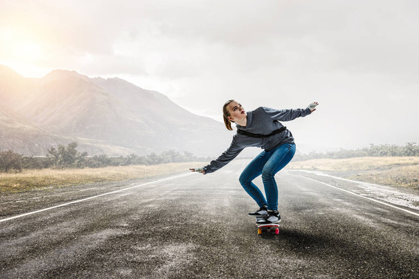 Teenager girl ride her skateboard. Mixed media - Photo, Image