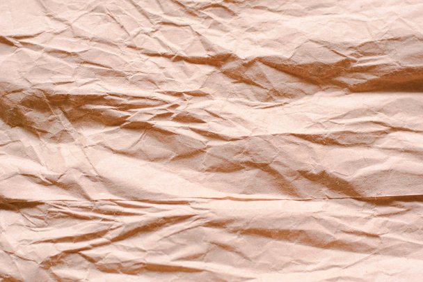 Backgrounf of old wrinkled crumpled craft package wrapping paper texture - Photo, Image