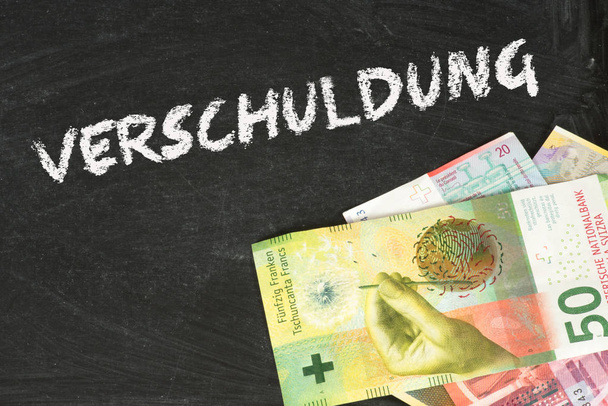 Banknoten Schweizerフランケンと死にますVerschuldung - 写真・画像