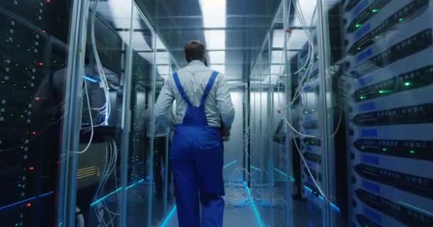 Two men performing maintenance in a data center - Footage, Video