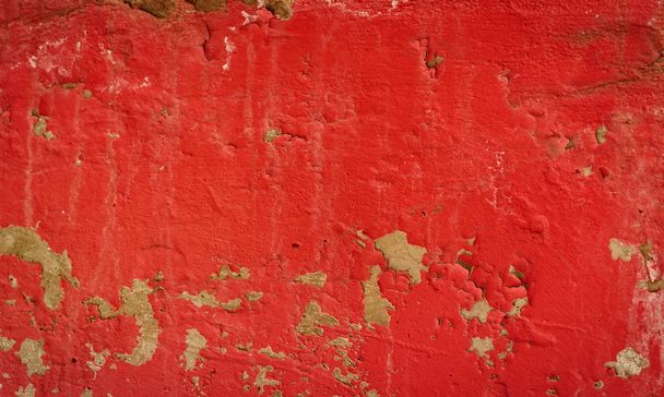 Achtergrond van een rode stucwerk bekleed en geschilderd buitenkant, ruwe cast van cement en betonnen muur textuur, decoratieve rustieke coating - Foto, afbeelding