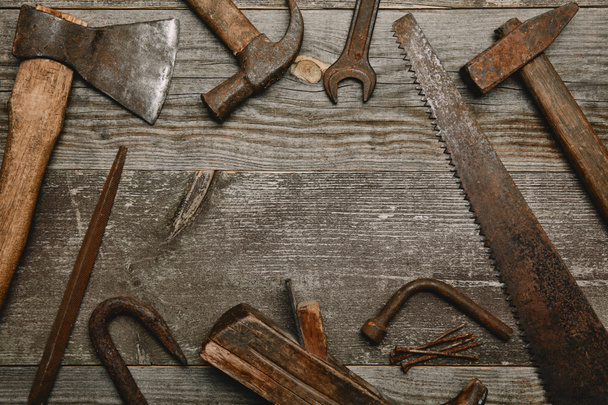 Top view of various tools on wooden background - Foto, immagini