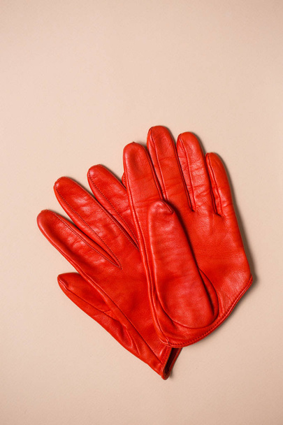 bright orange gloves made of genuine leather - Fotografie, Obrázek