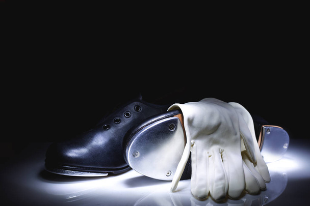 Tap shoes and gloves on dark background  - Photo, Image