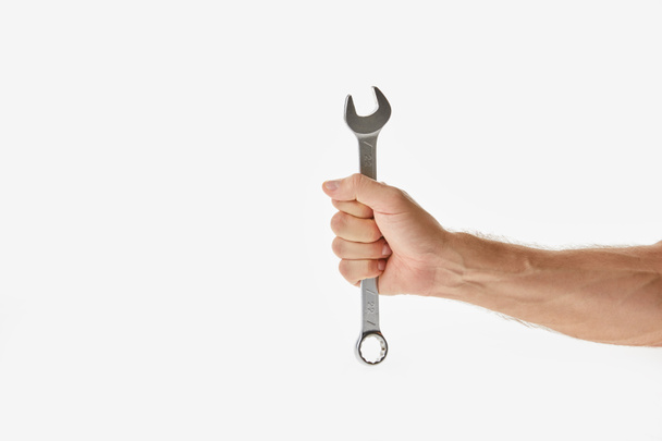 Partial view of man holding wrench isolated on white - Photo, Image