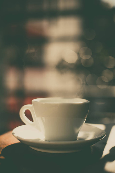 Color image of some steam coming out of a coffee cup. - 写真・画像