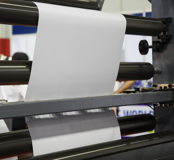 roll of white paper in modern paper cutting machine - Photo, Image