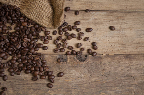 Chalkboard with coffee beans and a cup of coffee on natural brown wood - Φωτογραφία, εικόνα