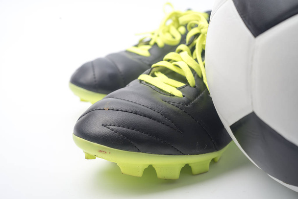Football and a football shoes  isolated on white background. - 写真・画像
