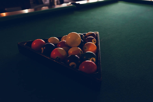 Playing billiard. Billiards balls green billiards table. Billiard sport concept. Pool billiard game. - Fotó, kép