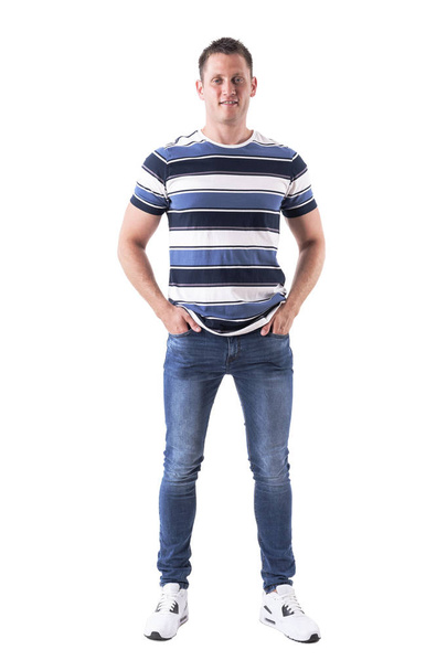 Confident successful happy man in casual clothes with hands in pockets smiling and looking at camera. Full body isolated on white background.  - Fotó, kép