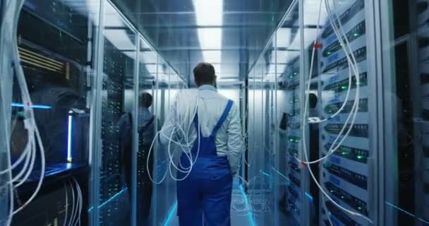 Two men working in a data center - Footage, Video