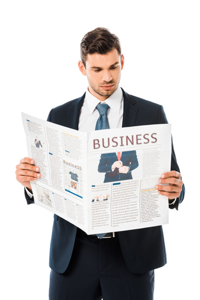 handsome businessman in suit reading business newspaper isolated on white - Photo, image