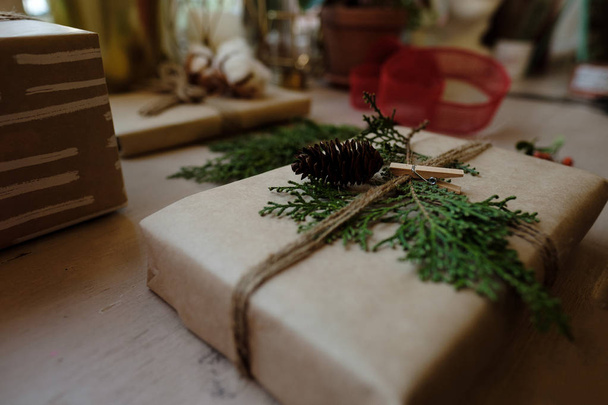 Classy Christmas gifts box presents on brown paper. Christmas presents with handmade decoration - 写真・画像