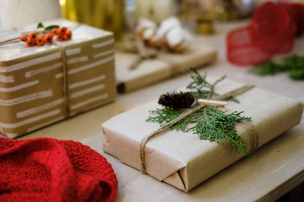 Classy Christmas gifts box presents on brown paper. Christmas presents with handmade decoration - Fotografie, Obrázek