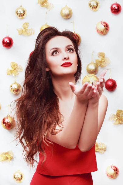 Christmas Portrait of Happy Woman on christmas background. Woman Xmas and New Year Concept - Photo, Image