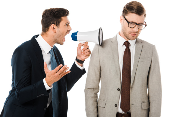 aggressive boss yelling with megaphone at upset employee isolated on white - 写真・画像