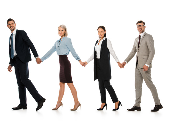 επιτυχημένη επιχειρηματική ομάδα, κρατώντας τα χέρια και τα πόδια μπροστά απομονωθεί σε λευκό - Φωτογραφία, εικόνα