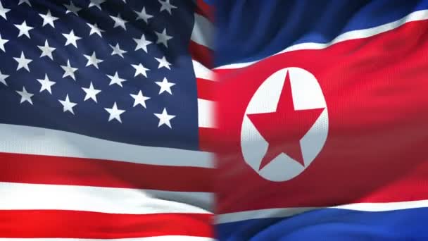 Egyesült Államok és Észak-Korea zászlók háttere, a diplomácia és a gazdasági kapcsolatok - Felvétel, videó