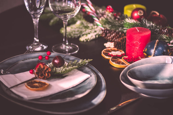 Rustic table setting for holiday Christmas dinner on dark wooden table with copy space - Valokuva, kuva