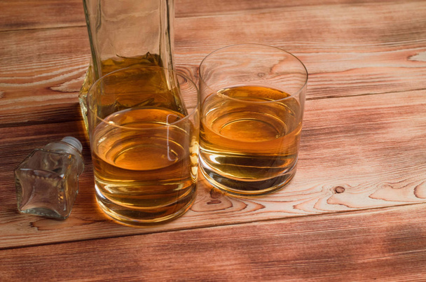 Glasses for whiskey on a wooden table - Foto, Imagen