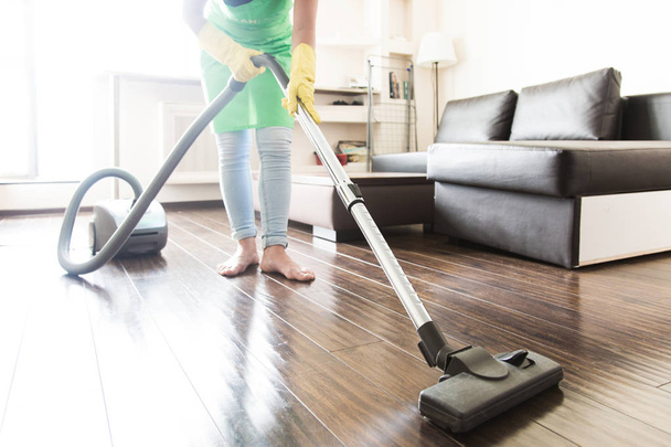 cleaning service. dust removal with vacuum cleaner. clean floor at home - Foto, Imagem