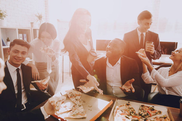 Team of Managers Have Lunch in Modern Office. Rest after Business Meeting. Modern Office Concept. Cooperation with Colleagues. Businessman with Team. Pizza in Box. Businessman in Suit. - Foto, Imagem
