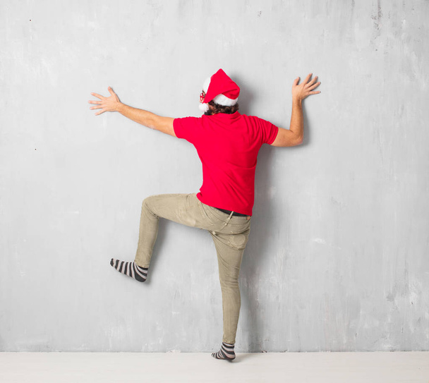 Young crazy man full body. Christmas concept. - Photo, image