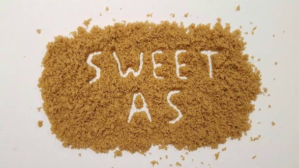 Sweet As Spelled Out in Brown Sugar.  Sweet As Sugar Abstract Design. - Photo, Image