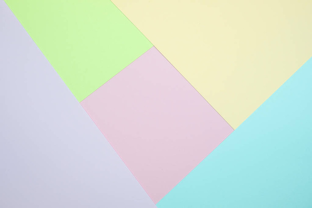 Fashionable  pastel colored paper flat lay top view, geometric background texture, pink, purple, yellow, beige, green and blue colour. - Zdjęcie, obraz