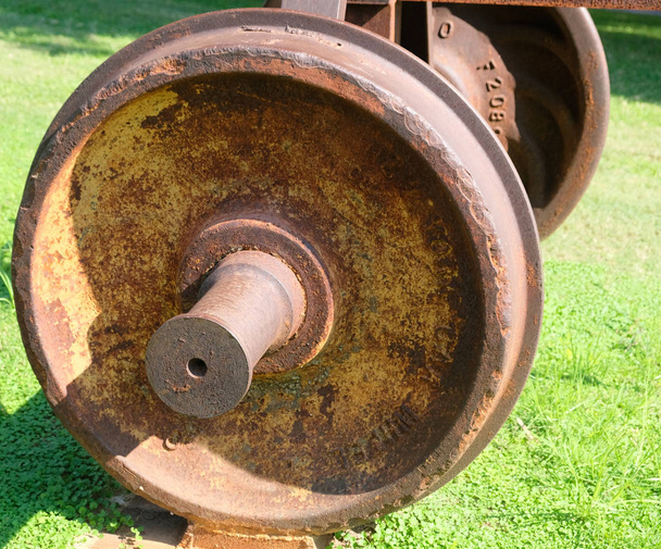 The wheel covered with rust from the car of the old railway. - Photo, Image