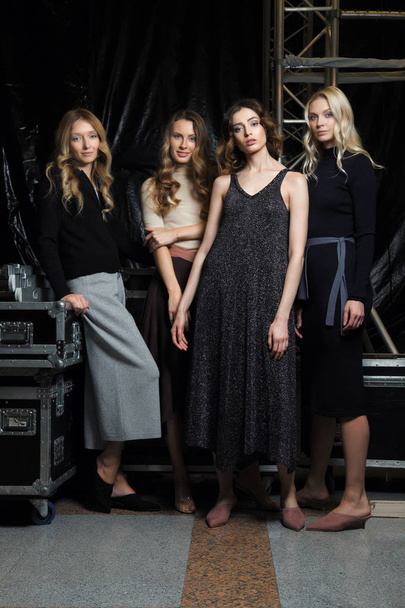 Four beautiful girls in knitted clothes. Happy fashion models. - Valokuva, kuva