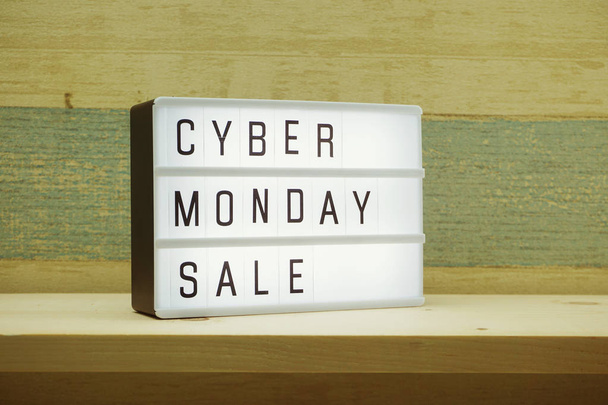 Cyber Monday sale shopping concept alphabet letter and alarm clock on wooden background - Fotografie, Obrázek