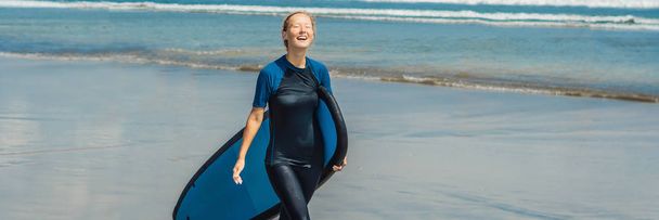 Young woman in swimsuit with surf for beginner ready to surf.  - Фото, зображення