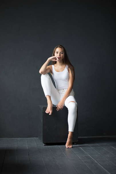 Attractive young woman in blank white tank-top. Mock-up. - Fotografie, Obrázek