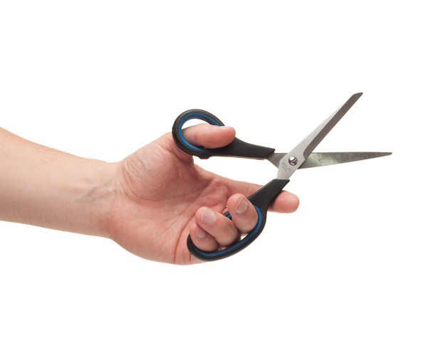 hand holding a scissors - Foto, afbeelding
