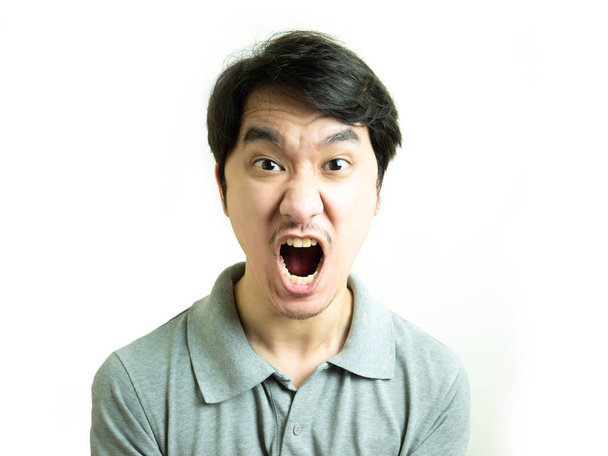 Young asian man yelling on white background. - Photo, Image