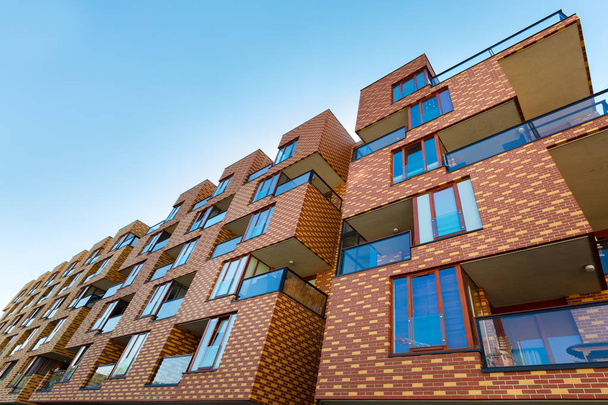 Exterior of new  apartment buildings on a blue sky background. No people.  Real estate business concept. - Photo, Image