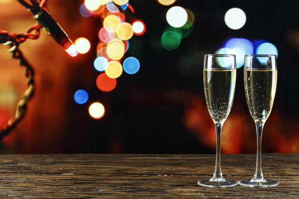 Two empty glasses f champagne on bokeh background. - Фото, изображение