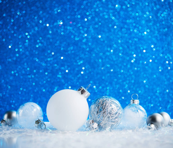 White and silver Christmas decorations on blue background - Zdjęcie, obraz