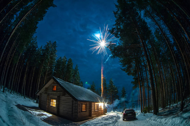 A lonely house in a pine forest during a salute - Fotoğraf, Görsel