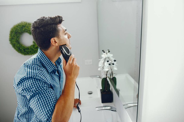 man is shaving his face - Photo, image